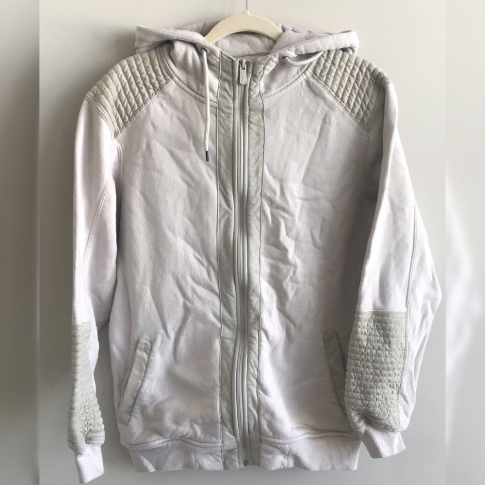 Worn, cream zip up sweater.